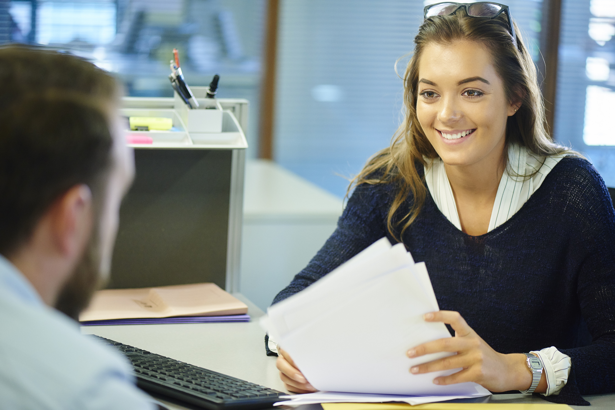 Male student interacting with a female tuition advisor 