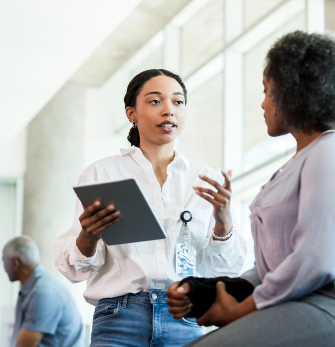 Woman talking to patient about occupational therapy